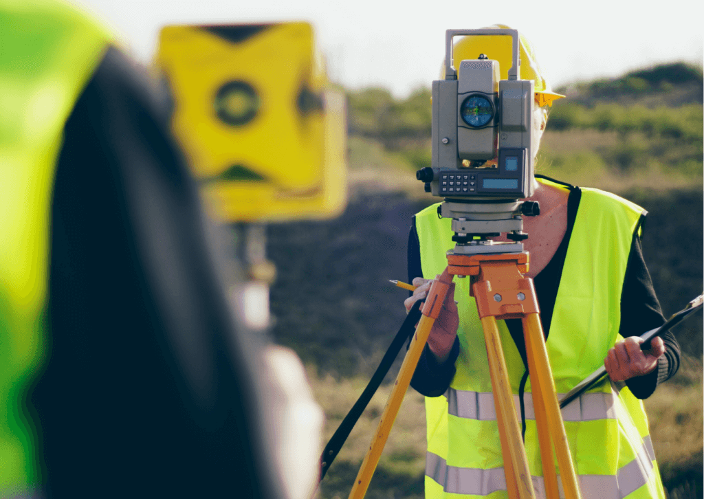 surveyor using equipment
